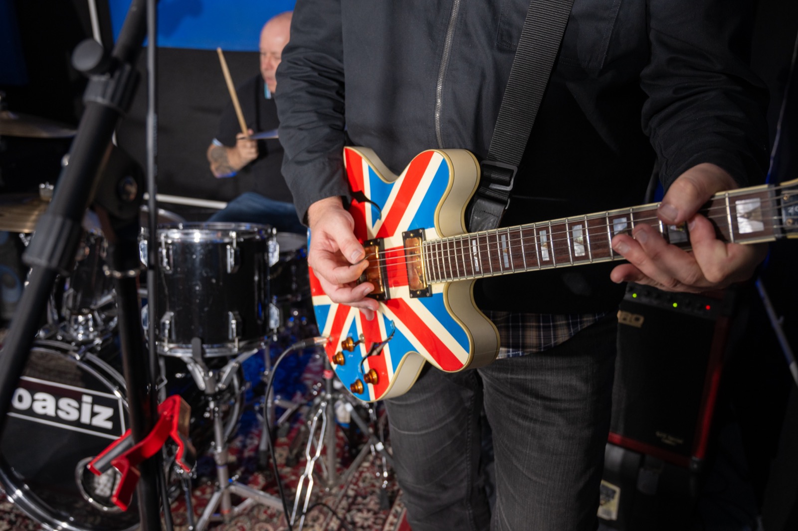 Close-up of a Union Jack electric guitar during a live music session