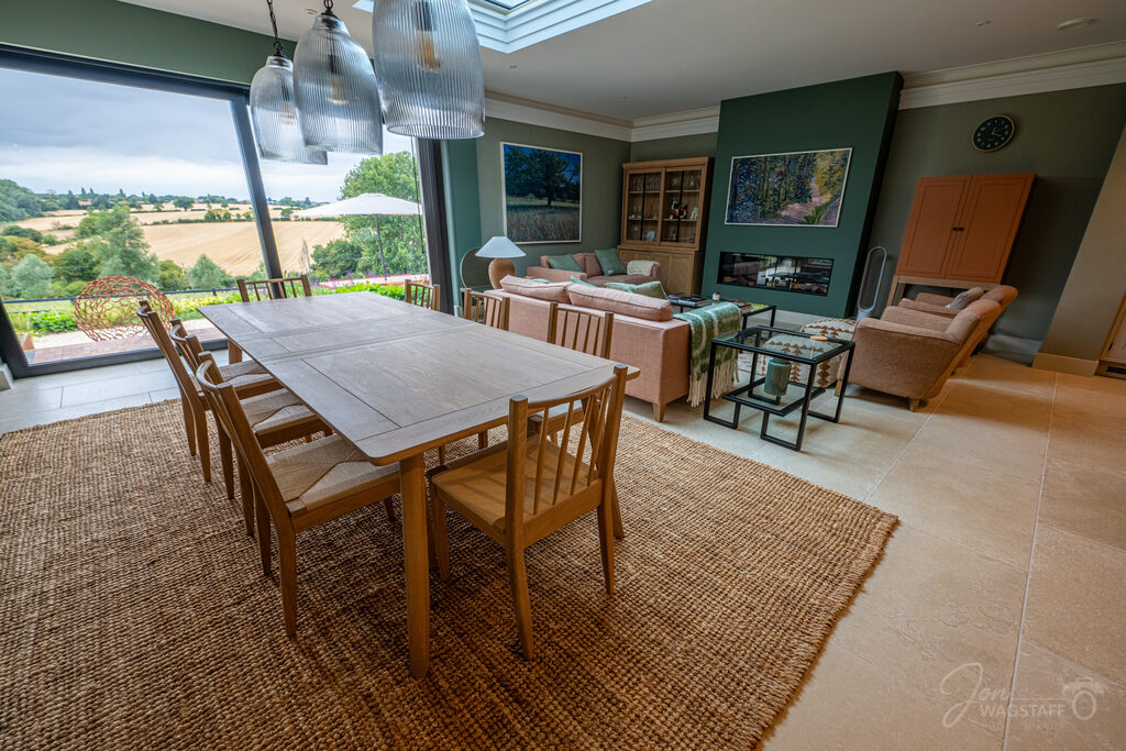 Open-plan living and dining room with countryside views at Warwick House, photographed by Jon Wagstaff