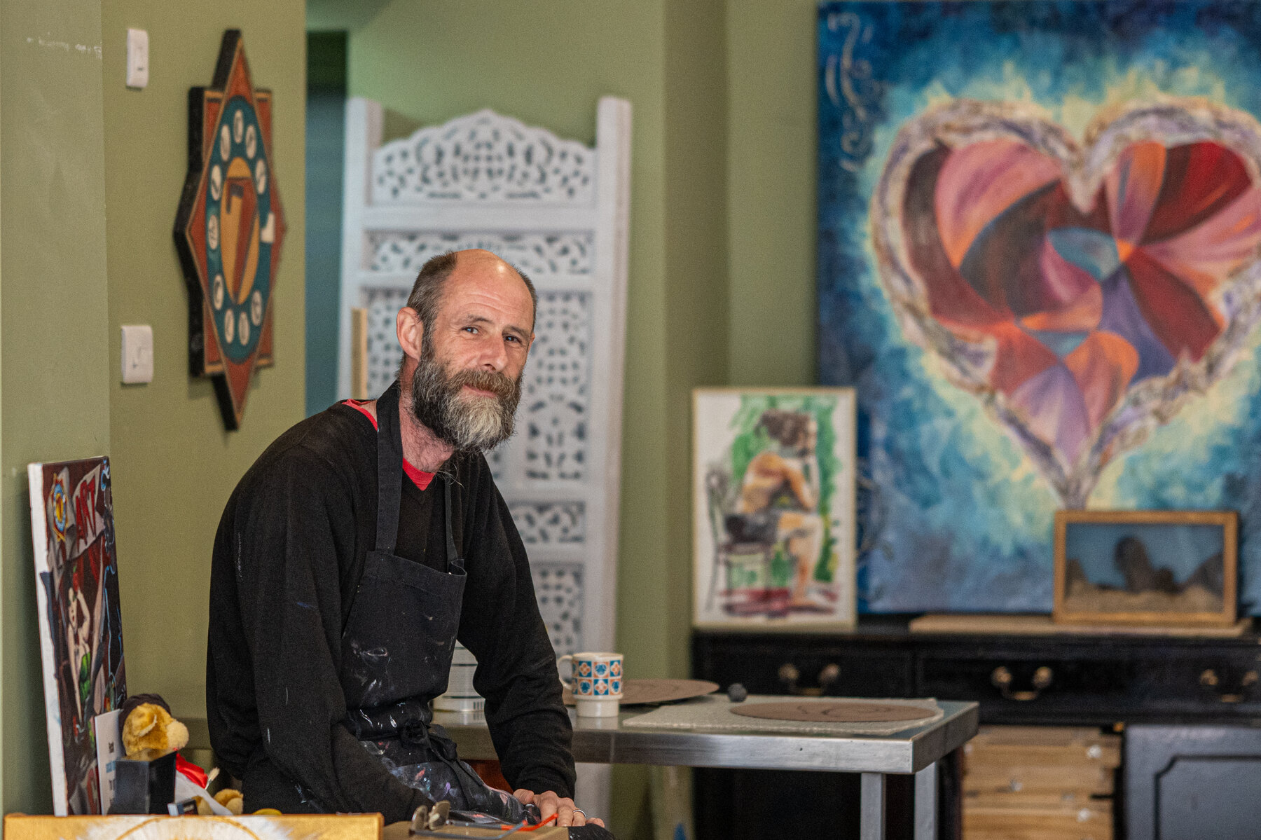 A Kick Up The Arts gallery owner, environmental portrait by Jon Wagstaff