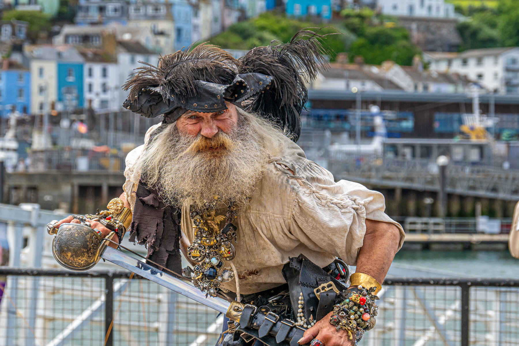 Costumed pirate street performer, environmental portrait by Jon Wagstaff