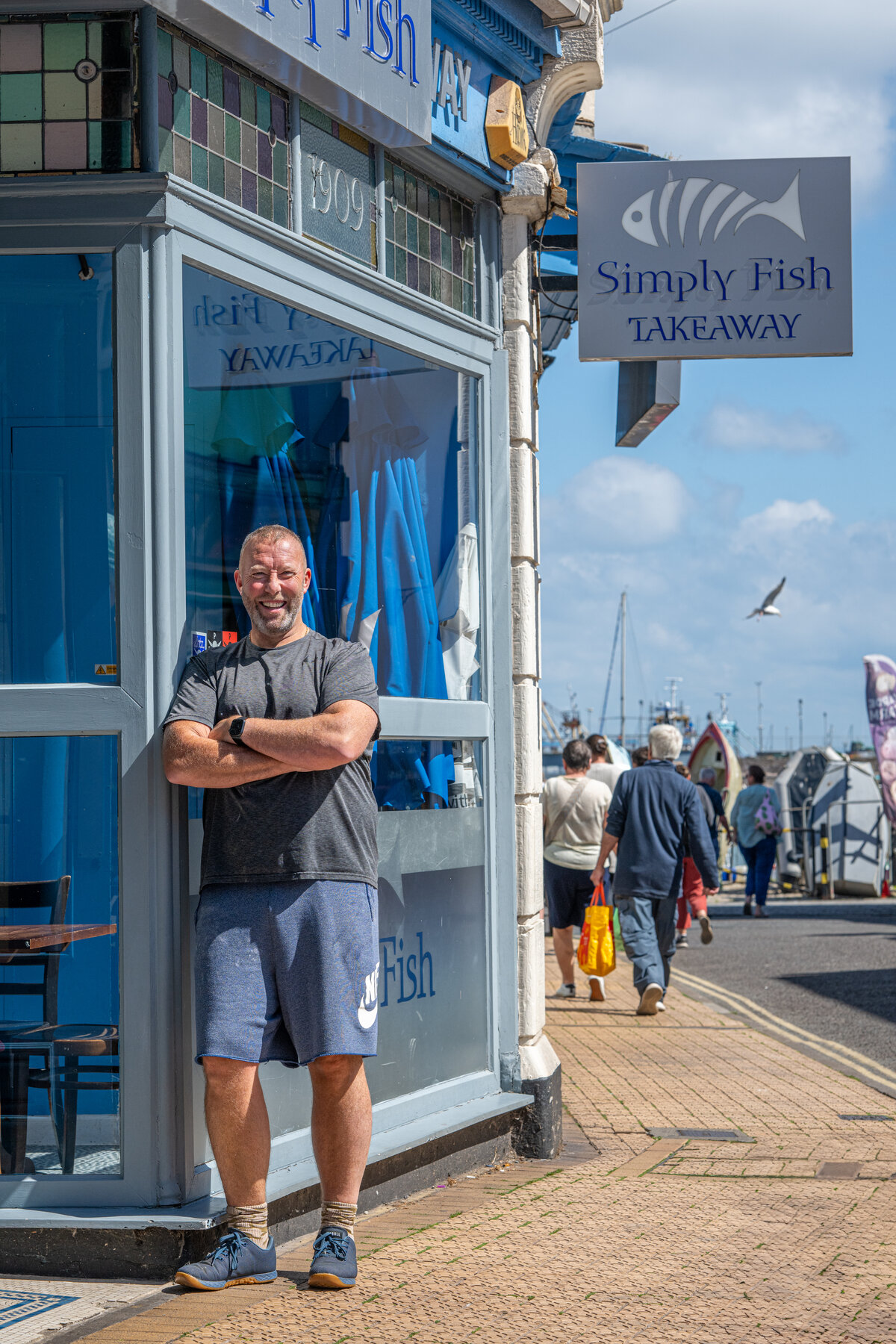 Simply Fish takeaway owner, street portrait by Jon Wagstaff
